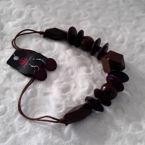 Fine polished wood African jewelry costume with earrings.